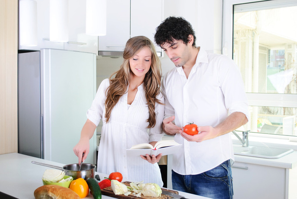 Couple cooking together in the kitchen